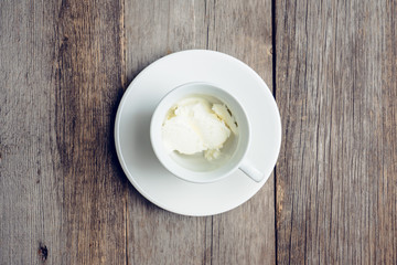 Cup with ice cream ready for adding coffee. Selective focus.