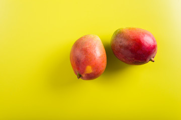 Fresh mangoes on bright background