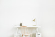© Floral Deco - Bright home office desk workspace. Nordic modern minimal interior design concept. Desktop table and wooden chair in white room. Scandinavian style.