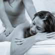 © Denys Kurbatov - Relaxed woman sleeping while having back massage procedure. photo converted in black and white with a blue tint