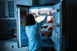 © Andrey Popov - Woman Keeping Food In Refrigerator
