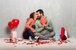 © luismolinero - Couple in valentine day holding a heart symbol and kissing
