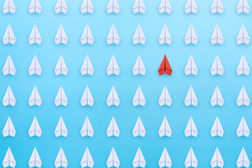 Wall Mural - Business for new ideas creativity, innovative and solution concept. Group of paper planes in one direction with one individual is different on blue background.