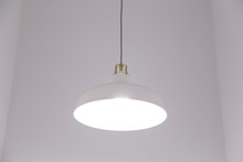 White Lighting Fixture With White Wall Background.