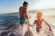 © Mediteraneo - Father and son playing on the beach at the day time