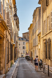 Fototapeta Na drzwi - Walking past the beautiful weathered apartment buildings in the charming city of Aix-en-Provence