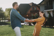 © Yakobchuk Olena - Smiling husband and wife having fun outdoor