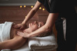 Lady having decollete massage in spa salon