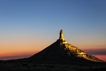 Wall Mural - Chimney Rock National Historic Site illuminated at night, western Nebraska, USA