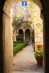  Architecture, exterior and design concept - Arches of long niche leading in Mediterranean courtyard or patio.