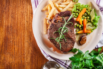 Wall Mural - Beef steak served with baked potatoes