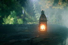 Retro Style Lantern At Night. Beautiful Colorful Illuminated Lamp At The Balcony In The Garden. Selective Focus
