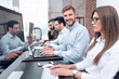 © ASDF - employees of the business center work on computers