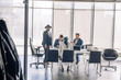 © alfa27 - Elegant well-dressed business men of different age and ethnicity in suits gathered together for negotiating, collaborating in spacious modern office meeting room