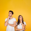 © Prostock-studio - Thoughtful couple thinking and touching chin over background