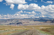 © Serg Zastavkin - Empty Asphalt road in Mongolia  with mongolian town Bayan-Olgii (Bayan-Ulgii or Ulgii) on background