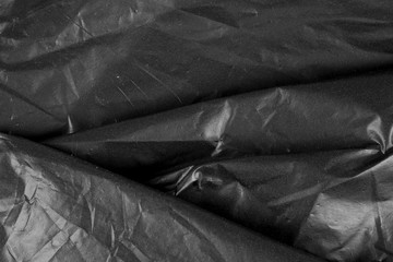 Canvas Print - Abstract background crumpled plastic film texture black garbage bag