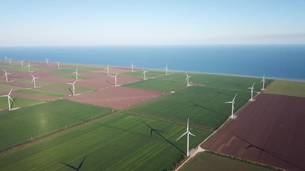 Wall Mural - Wind power station on field. Technology and inovation. Green energy composition. Wind turbines. Industrial landscape