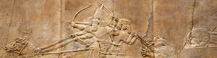 Assyrian wall relief of lion hunt, ancient history of Babylon and Shumer