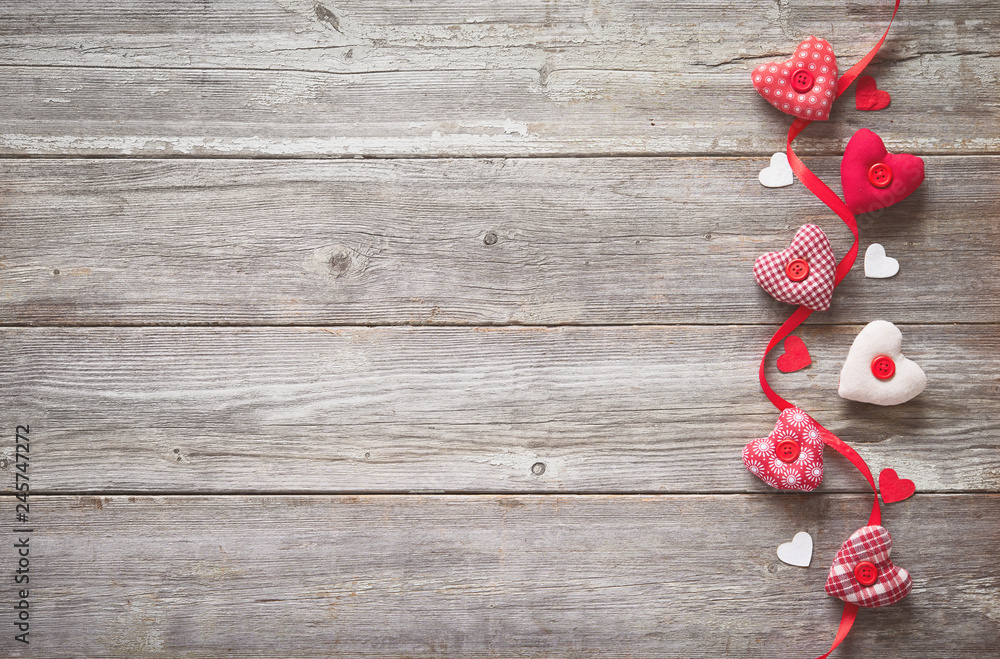 Valentines day background with handmade  textile hearts - obrazy, fototapety, plakaty 