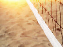 Volleyball Net On A Tropical Beach Against The Backdrop Of Sand. Copy Spase. Sun Leak.