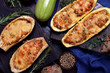 Stuffed eggplant and zucchini halves roasted with cheese 