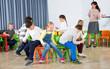 © JackF - Pupils with teacher playing musical chairs