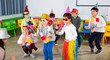 © JackF - School kids with teacher in festive hats having fun