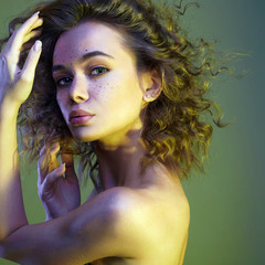 Wall Mural - Beautiful woman in color Light. amazing curly girl