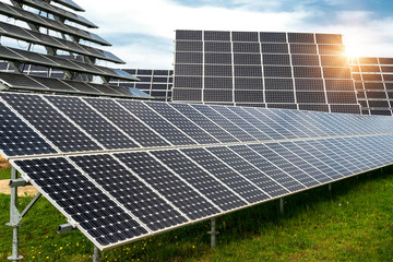 Solar panels, photovoltaics, with sun tracking systems -  alternative electricity source, concept of sustainable resources