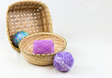 Balls Of Lavender And Multi-color Yarn In Baskets