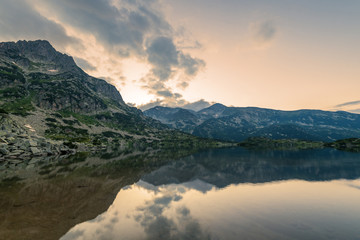 Popovo lake at Bezbog, Bulgaria and mountains reflection.