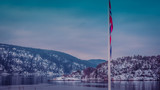 Fototapeta  - Flaga Norwegii na tle fiordu