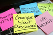 Change your password. Laptop with pieces of paper.