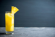 Fresh Pineapple Beverage On Rustic Background. Selective Focus. Shallow Depth Of Field.