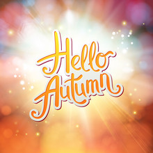 Dynamic Orange Hello Autumn Card Design With A Sunburst Or Explosion.
