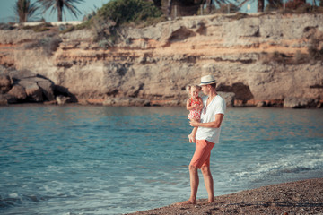 Portrait of happy father and daughter at sea