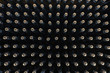 Pattern of sparkling wine bottles seen from above