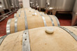 Oak barrels for aging wine in a modern winery