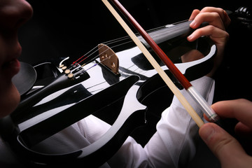 Wall Mural - Young men playing the violin