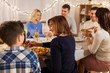 © Syda Productions - celebration, holidays and people concept - happy family having dinner party at home