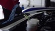 Oil change on a sports car in a workshop - Ölwechsel an einem Sportwagen in einer Werkstatt