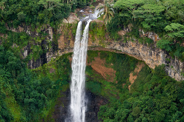 Wall Mural - Chamarel Waterfall on the south of the island of Mauritius as seen from a helicopter.