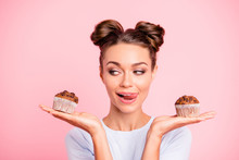 Close-up Portrait Of Nice Lovely Cute Fascinating Attractive Cheerful Hungry Foxy Girl Holding In Hands Two Cakes Choosing Deciding Isolated Over Pink Pastel Background