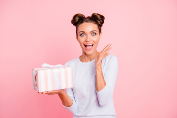 Poster - Portrait of her she nice attractive lovely sweet fascinating cheerful cheery glad girl holding in hands bow ribbon box isolated over pink pastel background