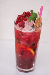 Poster - Tasty cold fresh drink lemonade with raspberry, mint, ice and lime in glass 