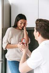 Sticker - Happy young man making a proposal to his girlfriend