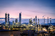 © weerapong - Manufacturing of petroleum industrial plant on sky twilight background, Oil and gas refinery or Petrochemical industry plant with distillation tower