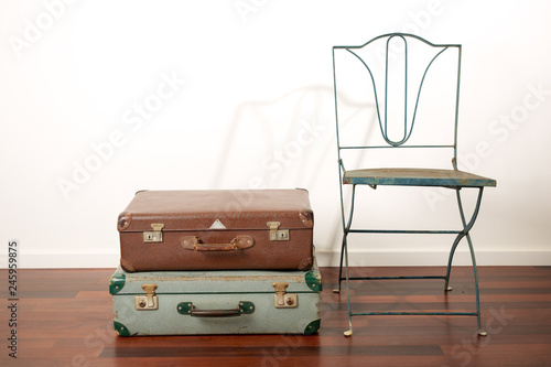 Two Old Retro Suitcases Vintage Metal Lawn Chair Wooden Floor And A White Stucco Background Buy This Stock Photo And Explore Similar Images At Adobe Stock Adobe Stock