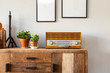 © annebel146 - Retro living room design with cabinet and radio along with green plants and blank paintings, white wall